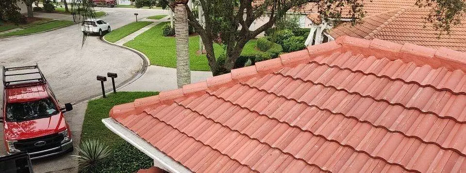 tile roof replaced in neighborhood in Florida with reddish color